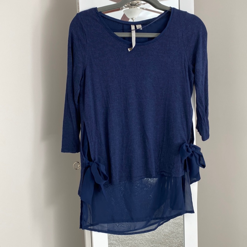 Shirt with sheer accent layer